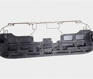 This automotive interior part uses lightweight composite materials to reduce weight, and its structure design includes built-in buffering for collision protection.